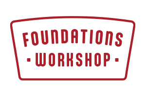A logo with a black and red color scheme that reads "Foundations Workshop" in a stylized font, with the text enclosed in a trapezoid-like shape.